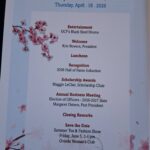 Event agenda for the Women's Club at UCF 2026 Spring Luncheon, listing entertainment, luncheon, awards, business meeting, and details for a future event. Cherry blossom graphics decorate the page.